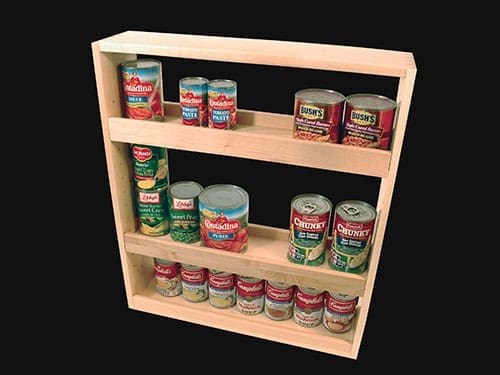 A kitchen slide out drawer with cans of food