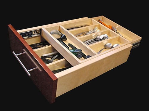 A double decker drawer with kitchen utensiles