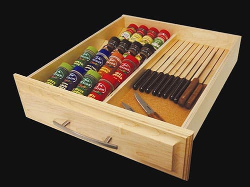 A knife block kitchen drawer with knifes and spices