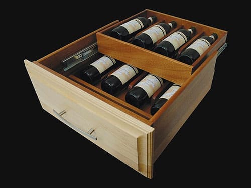 A large double deck drawer with several bottles of wine