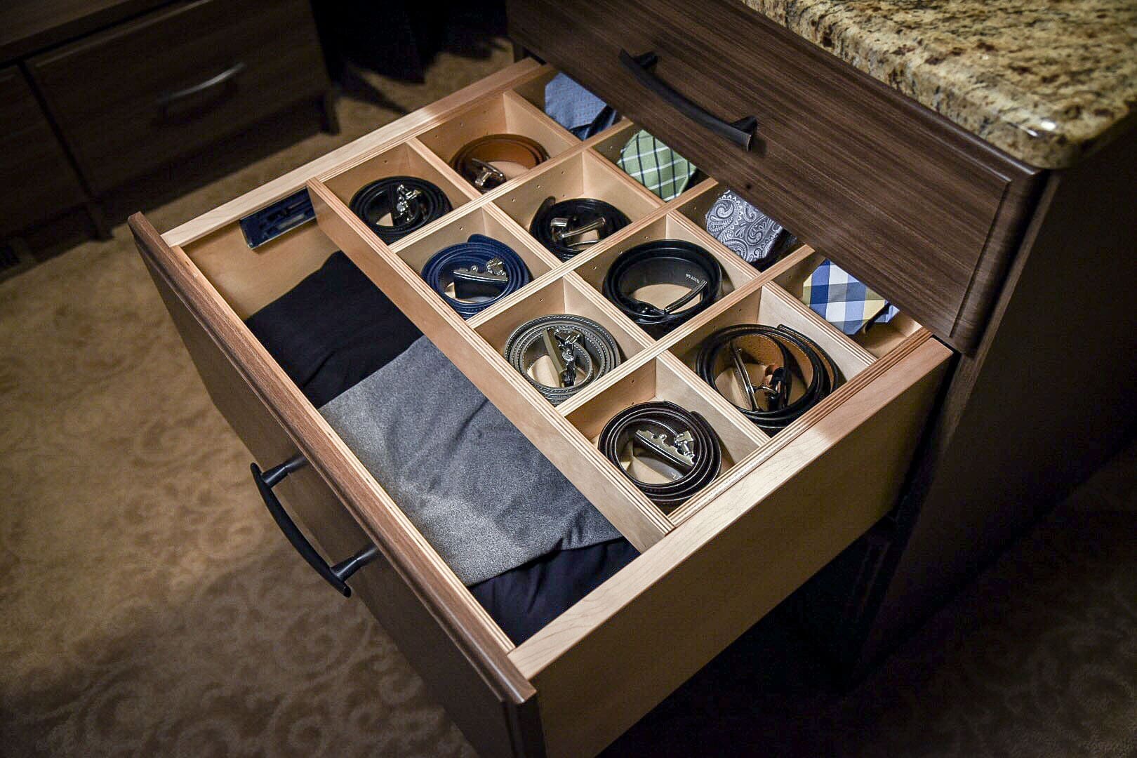 A closeup of a sock and tie drawer